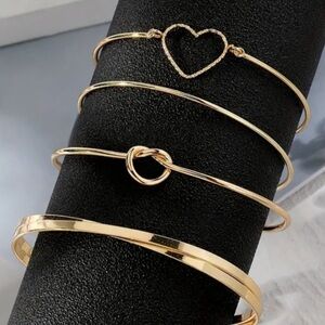 NWT 4 piece “knotted love” bracelet set